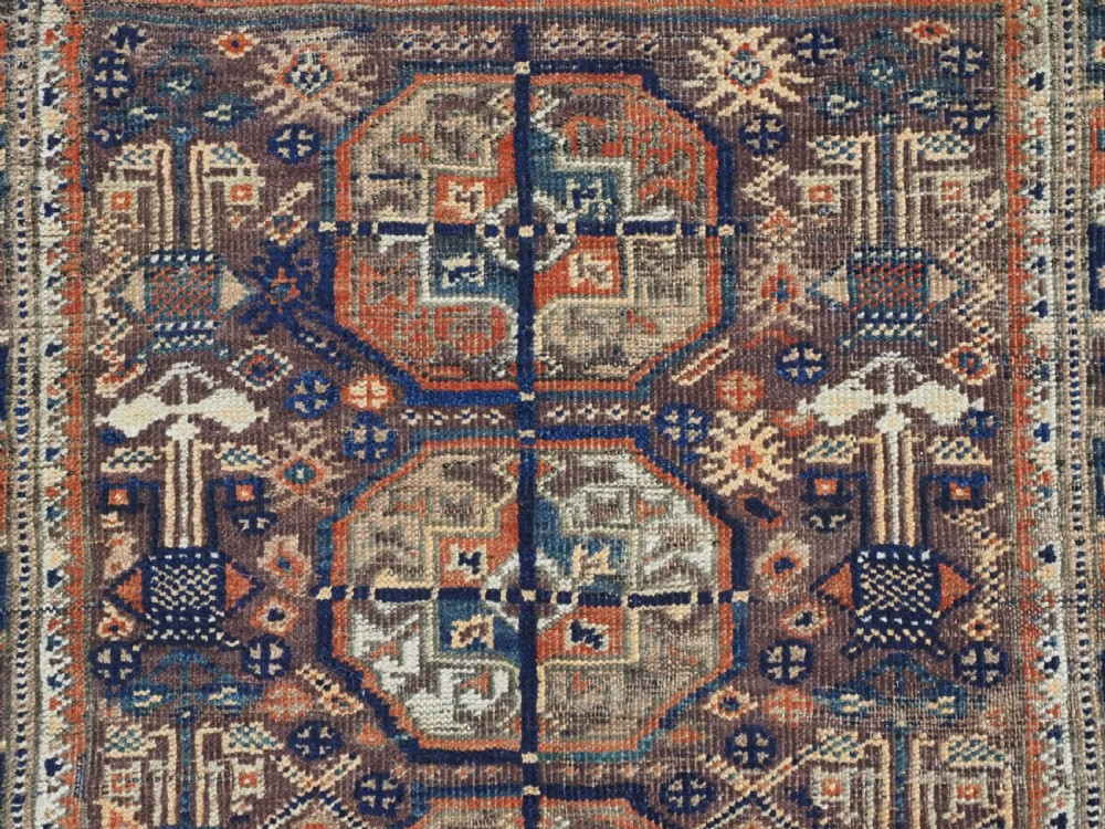 ANTIQUE MAHDAD KHANI BALUCH RUG OF INTERESTING TURKMEN GUL DESIGN, CIRCA 1880. View VIII