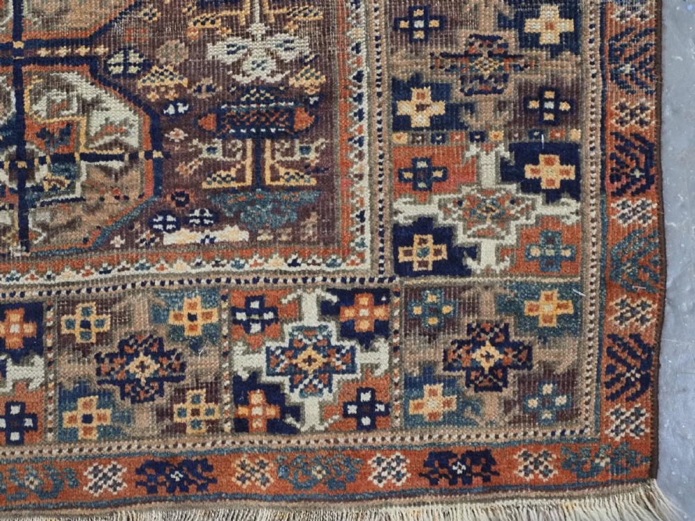 ANTIQUE MAHDAD KHANI BALUCH RUG OF INTERESTING TURKMEN GUL DESIGN, CIRCA 1880. View X