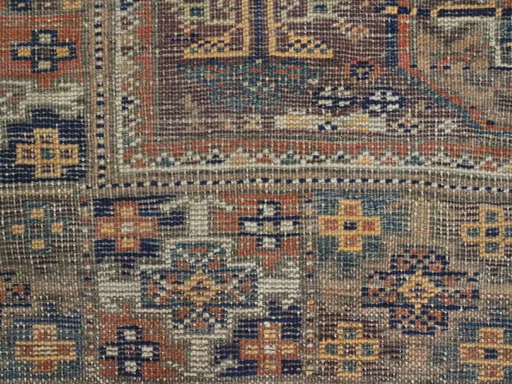 ANTIQUE MAHDAD KHANI BALUCH RUG OF INTERESTING TURKMEN GUL DESIGN, CIRCA 1880. View XII