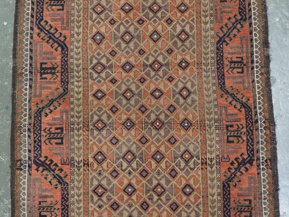 ANTIQUE BALUCH RUG, KHORASAN REGION, CAMEL GROUND, CIRCA 1890. View IV