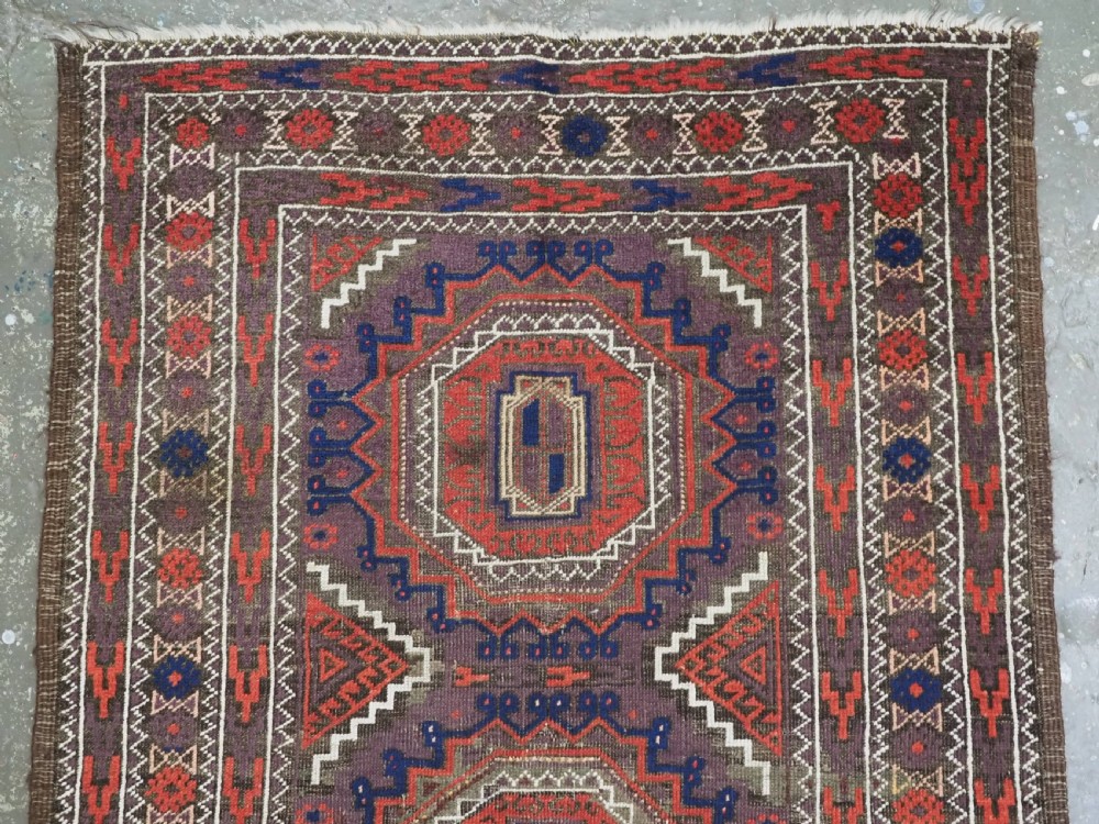 ANTIQUE KHORASAN BALUCH RUG, POSSIBLY SALAR KHANI WITH LARGE GULS, CIRCA 1900. View III