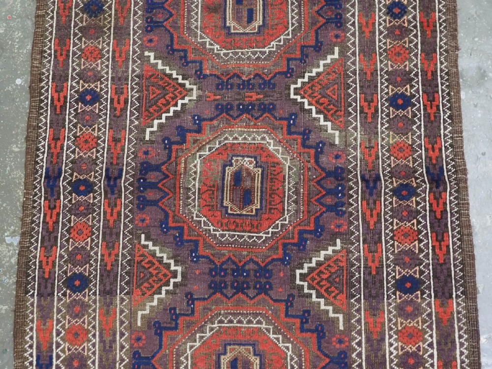 ANTIQUE KHORASAN BALUCH RUG, POSSIBLY SALAR KHANI WITH LARGE GULS, CIRCA 1900. View IV