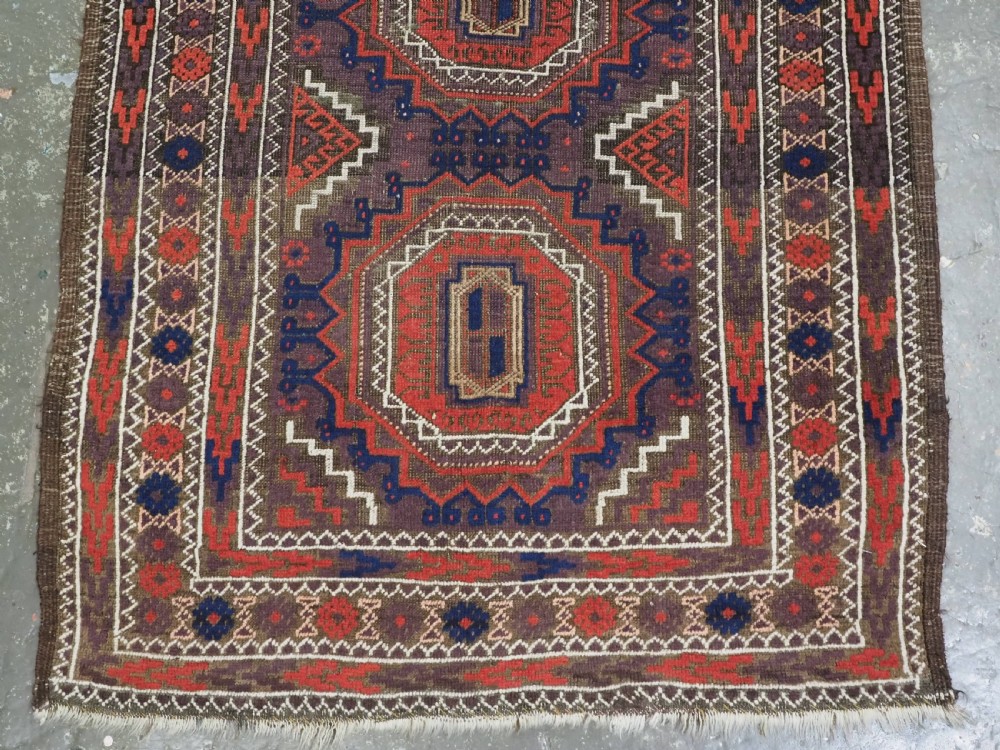 ANTIQUE KHORASAN BALUCH RUG, POSSIBLY SALAR KHANI WITH LARGE GULS, CIRCA 1900. View V