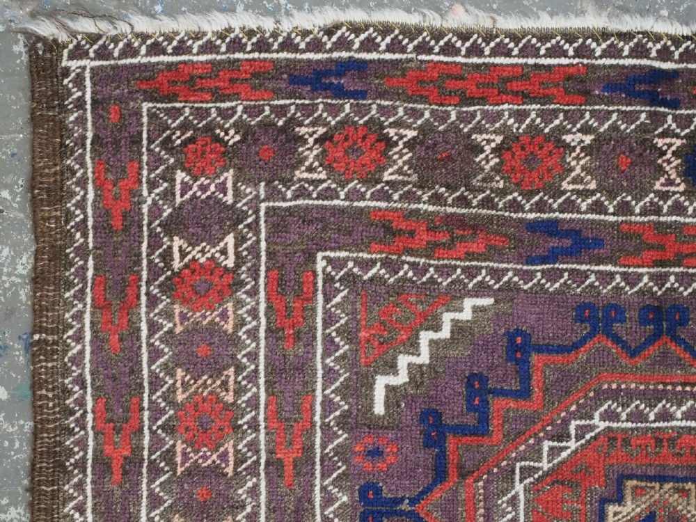 ANTIQUE KHORASAN BALUCH RUG, POSSIBLY SALAR KHANI WITH LARGE GULS, CIRCA 1900. View VI