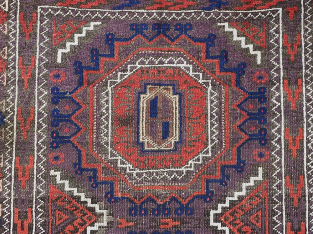 ANTIQUE KHORASAN BALUCH RUG, POSSIBLY SALAR KHANI WITH LARGE GULS, CIRCA 1900. View VIII