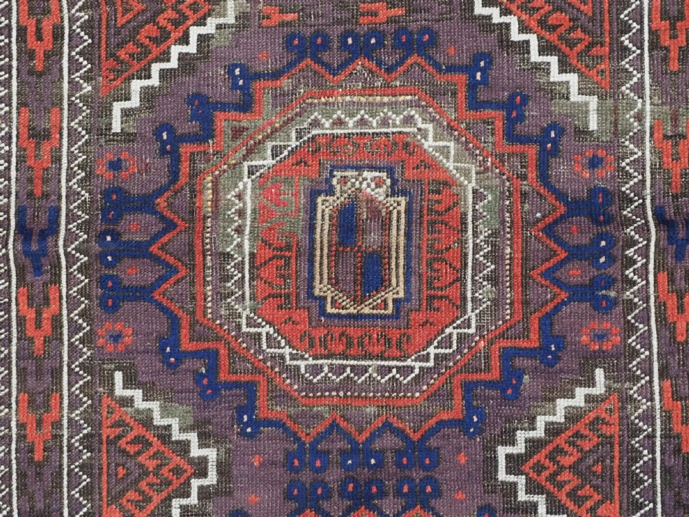 ANTIQUE KHORASAN BALUCH RUG, POSSIBLY SALAR KHANI WITH LARGE GULS, CIRCA 1900. View IX