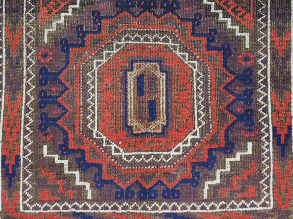 ANTIQUE KHORASAN BALUCH RUG, POSSIBLY SALAR KHANI WITH LARGE GULS, CIRCA 1900. View X