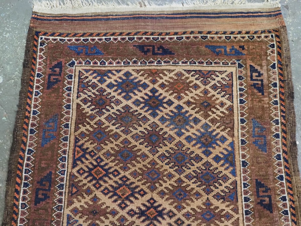 ANTIQUE KHORASAN BALUCH RUG, CAMEL GROUND, STAR GUL DESIGN, CIRCA 1890. View III