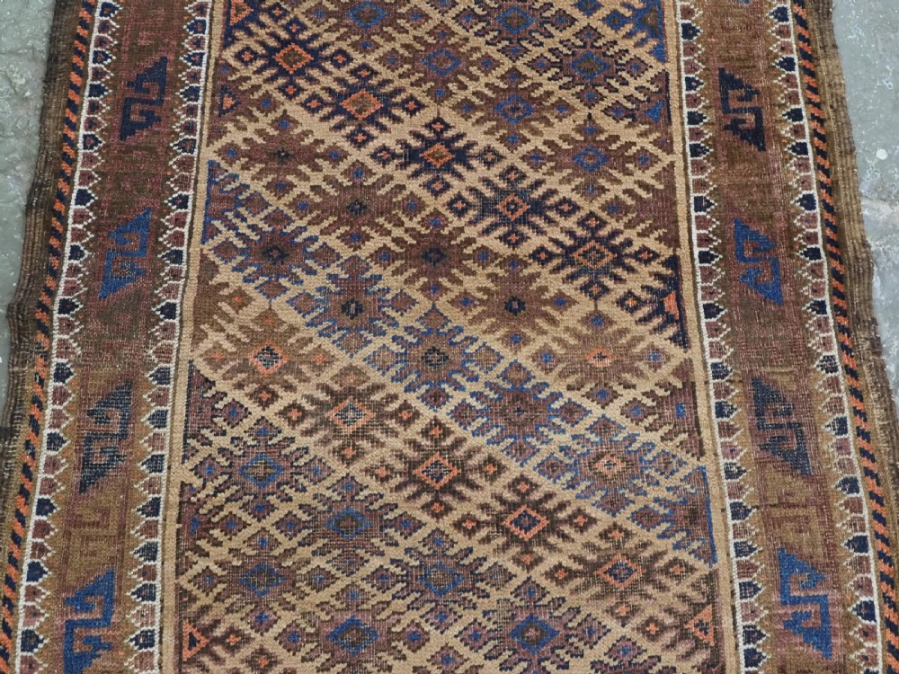 ANTIQUE KHORASAN BALUCH RUG, CAMEL GROUND, STAR GUL DESIGN, CIRCA 1890. View IV
