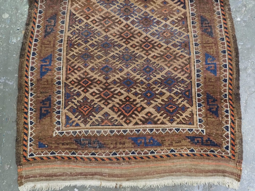 ANTIQUE KHORASAN BALUCH RUG, CAMEL GROUND, STAR GUL DESIGN, CIRCA 1890. View V