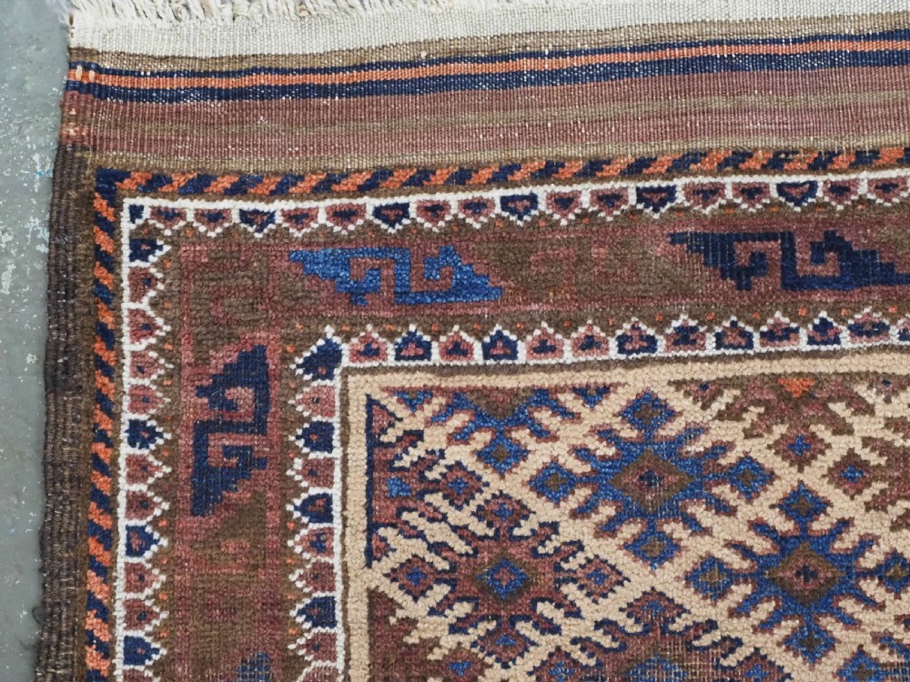 ANTIQUE KHORASAN BALUCH RUG, CAMEL GROUND, STAR GUL DESIGN, CIRCA 1890. View VI