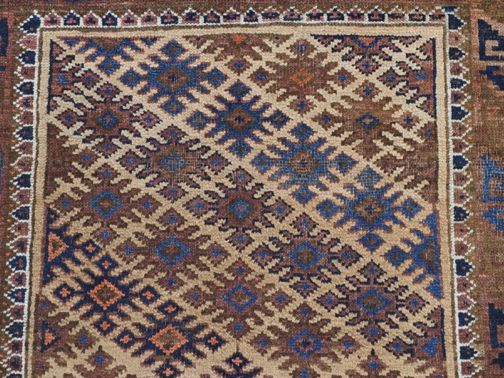 ANTIQUE KHORASAN BALUCH RUG, CAMEL GROUND, STAR GUL DESIGN, CIRCA 1890. View VIII