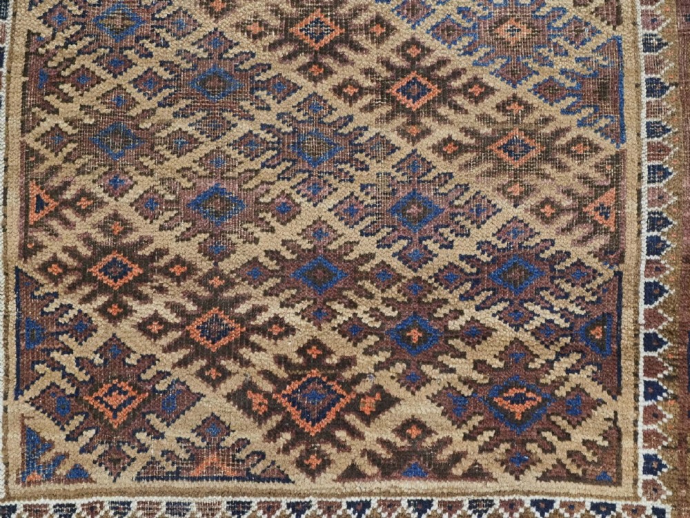 ANTIQUE KHORASAN BALUCH RUG, CAMEL GROUND, STAR GUL DESIGN, CIRCA 1890. View IX