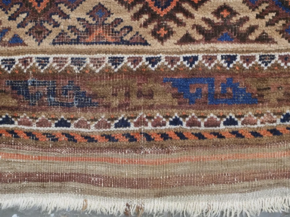 ANTIQUE KHORASAN BALUCH RUG, CAMEL GROUND, STAR GUL DESIGN, CIRCA 1890. View X