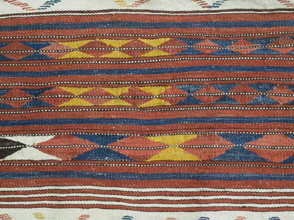 A flatwoven wool kilim rug featuring horizontal bands of cream, dark brown, and ochre with geometric diamond patterns. View XI