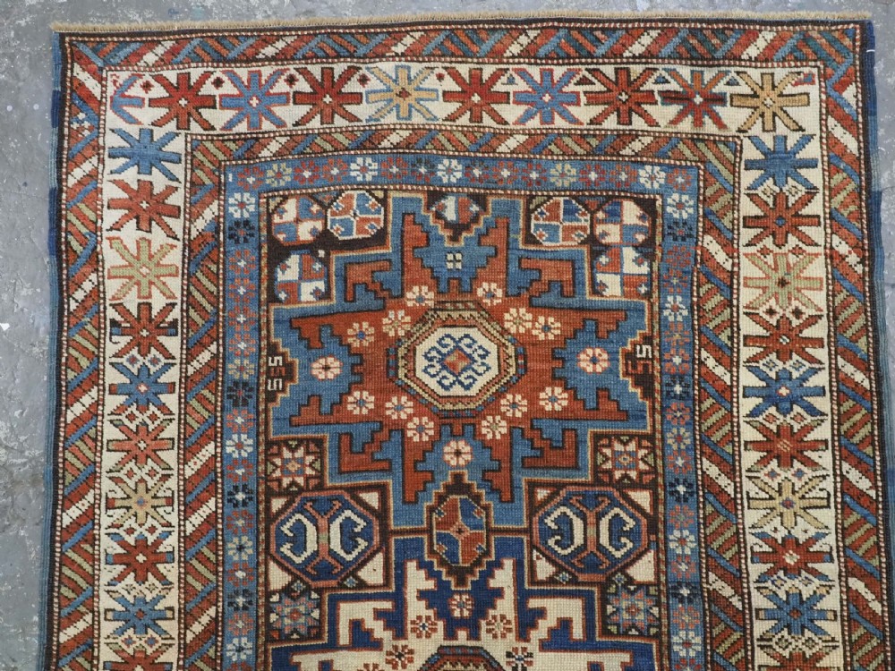 ANTIQUE CAUCASIAN RUG WITH LESGHI STAR DESIGN, EXCELLENT COLOUR, CIRCA 1890. View III