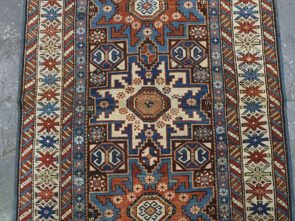 ANTIQUE CAUCASIAN RUG WITH LESGHI STAR DESIGN, EXCELLENT COLOUR, CIRCA 1890. View IV