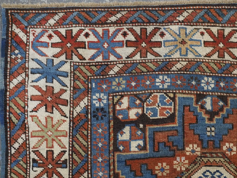 ANTIQUE CAUCASIAN RUG WITH LESGHI STAR DESIGN, EXCELLENT COLOUR, CIRCA 1890. View VI