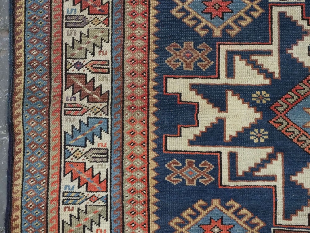 ANTIQUE CAUCASIAN LESGHI STAR DESIGN RUG, DATED 1328 / 1910. View VII