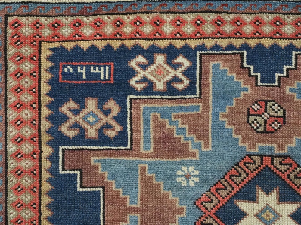ANTIQUE CAUCASIAN LESGHI STAR DESIGN RUG, DATED 1328 / 1910. View VIII