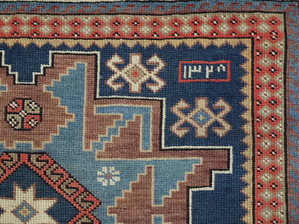 ANTIQUE CAUCASIAN LESGHI STAR DESIGN RUG, DATED 1328 / 1910. View IX