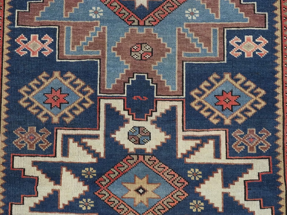 ANTIQUE CAUCASIAN LESGHI STAR DESIGN RUG, DATED 1328 / 1910. View X