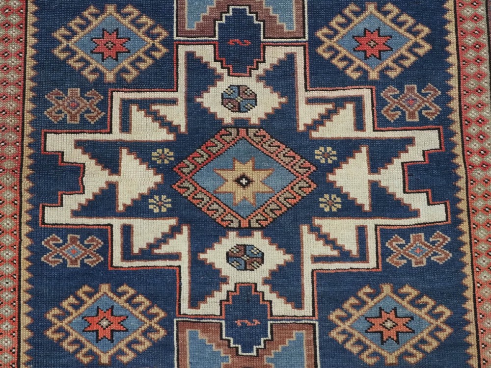 ANTIQUE CAUCASIAN LESGHI STAR DESIGN RUG, DATED 1328 / 1910. View XI