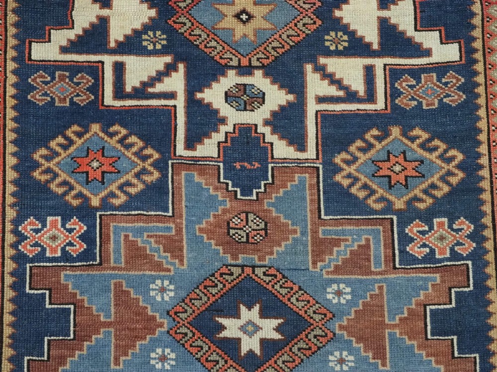 ANTIQUE CAUCASIAN LESGHI STAR DESIGN RUG, DATED 1328 / 1910. View XII