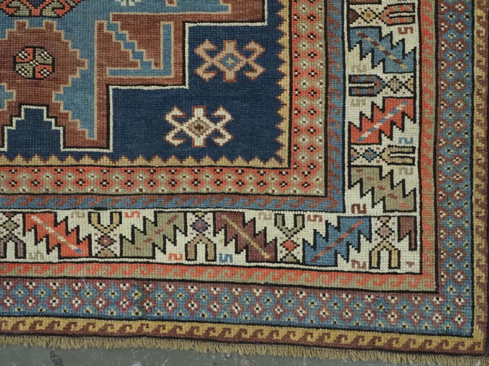 ANTIQUE CAUCASIAN LESGHI STAR DESIGN RUG, DATED 1328 / 1910. View XIV