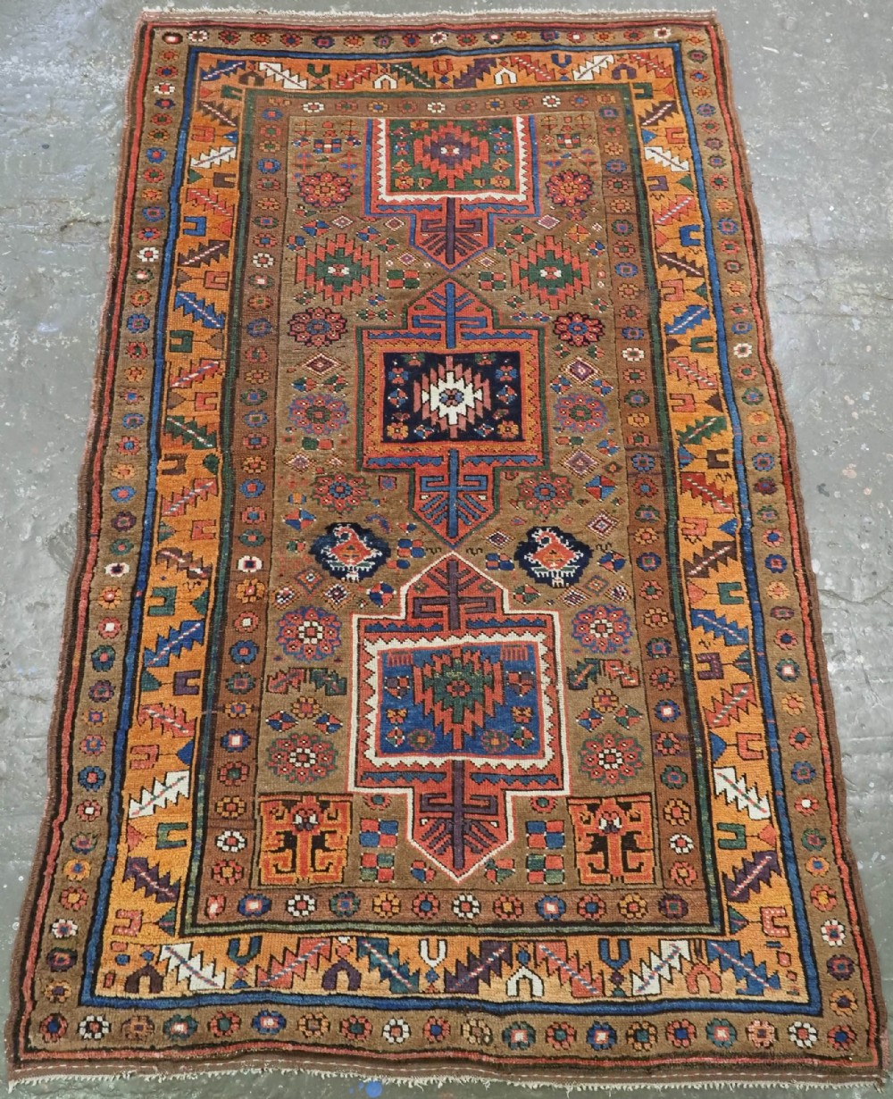 ANTIQUE KURDISH SAUJ BULAGH RUG, CAMEL GROUND, CIRCA 1880.