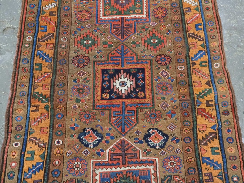 ANTIQUE KURDISH SAUJ BULAGH RUG, CAMEL GROUND, CIRCA 1880. View IV