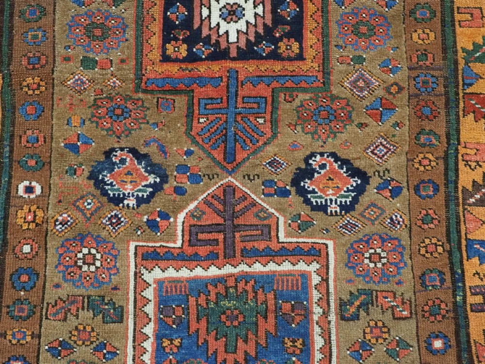 ANTIQUE KURDISH SAUJ BULAGH RUG, CAMEL GROUND, CIRCA 1880. View X