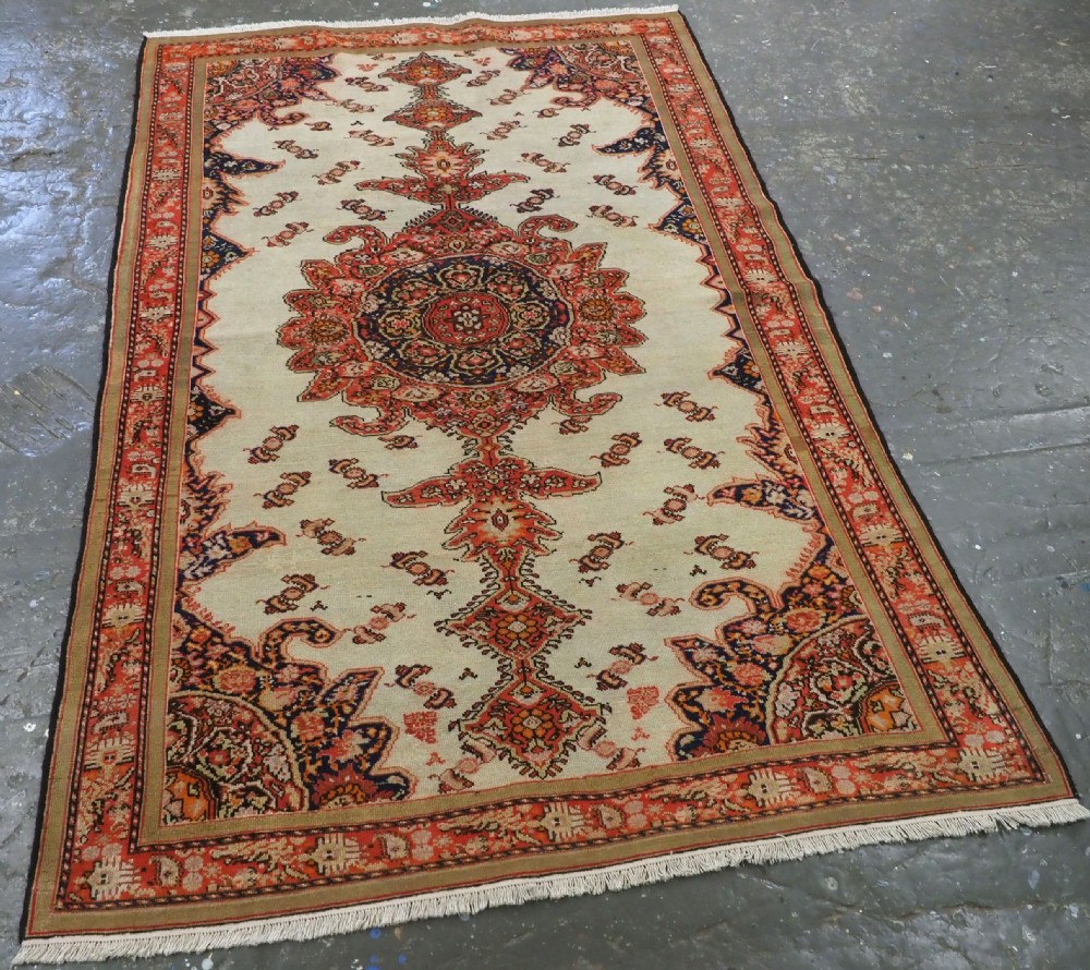An antique Persian Malayer hand-knotted wool rug featuring an ivory central field, a complex terracotta and navy medallion, butterfly motifs, and a detailed multi-stripe border. View II