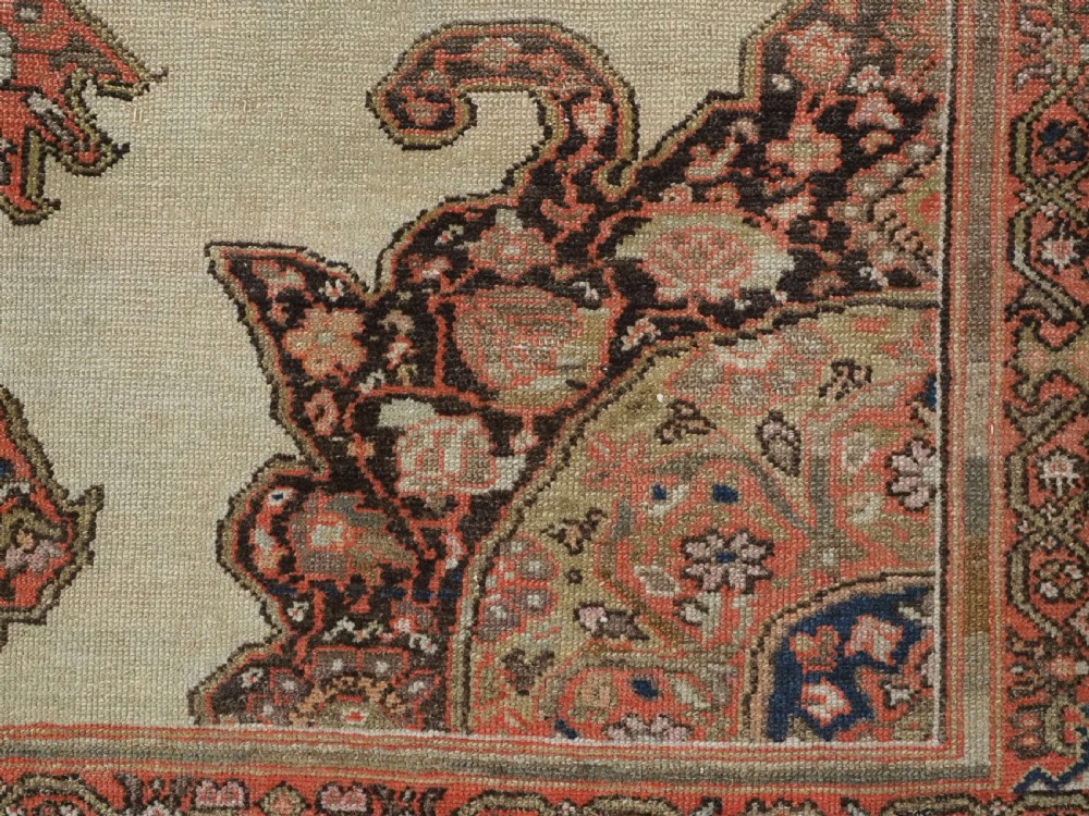 An antique hand-knotted Persian Malayer rug featuring a central terracotta medallion on a cream field with geometric patterned borders. View XI