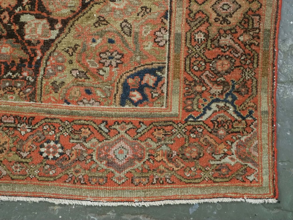An antique hand-knotted Persian Malayer rug featuring a central terracotta medallion on a cream field with geometric patterned borders. View XII