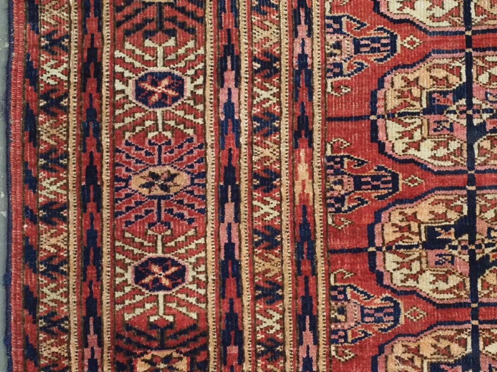 ANTIQUE TEKKE TURKMEN RUG WITH SOFT MADDER RED GROUND, CIRCA 1900. View VI