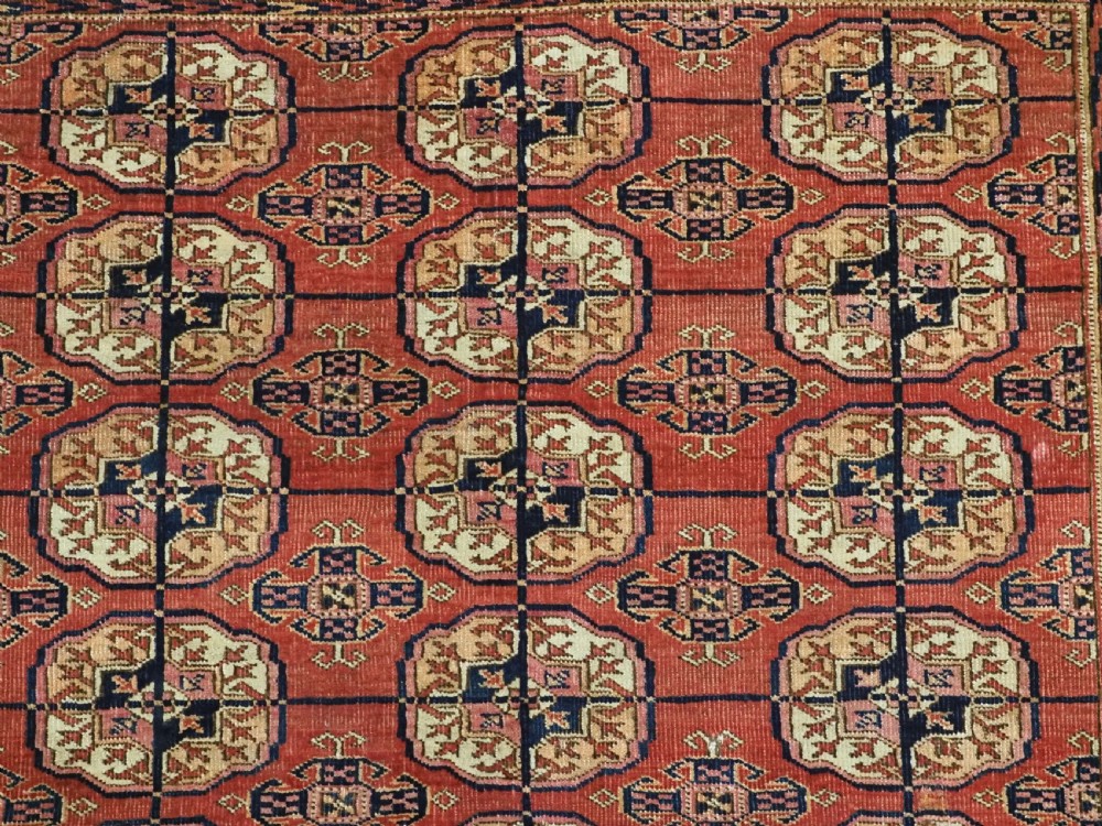 ANTIQUE TEKKE TURKMEN RUG WITH SOFT MADDER RED GROUND, CIRCA 1900. View VII