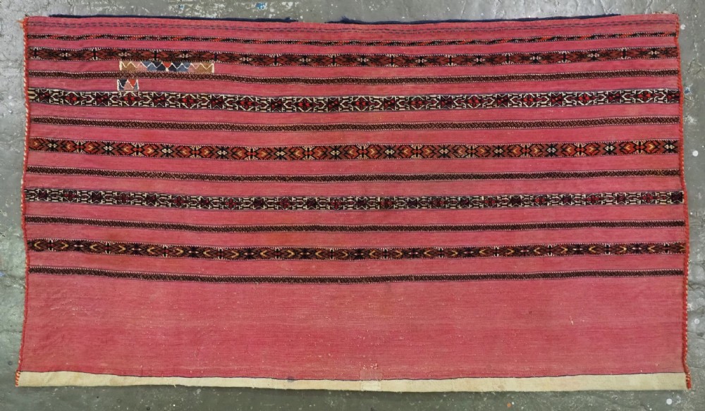 ANTIQUE TEKKE TURKMEN 'KIZIL' CHUVAL, VERY FINE WEAVE, COMPLETE WITH BACK, CIRCA 1880.