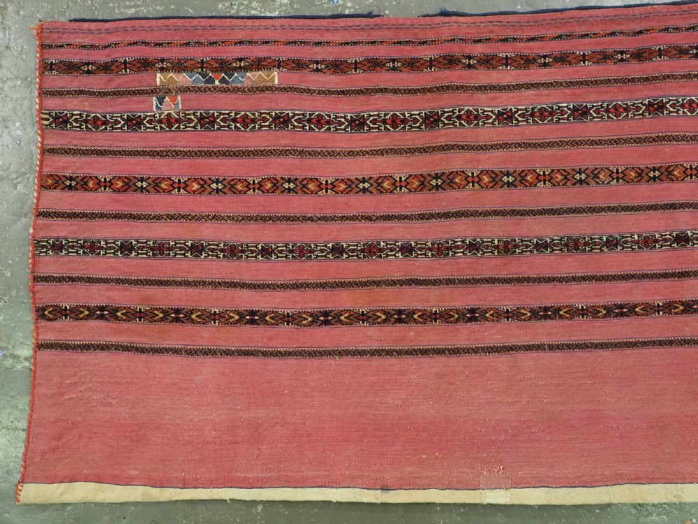 ANTIQUE TEKKE TURKMEN 'KIZIL' CHUVAL, VERY FINE WEAVE, COMPLETE WITH BACK, CIRCA 1880. View III