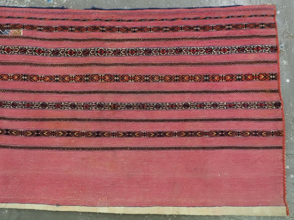 ANTIQUE TEKKE TURKMEN 'KIZIL' CHUVAL, VERY FINE WEAVE, COMPLETE WITH BACK, CIRCA 1880. View IV