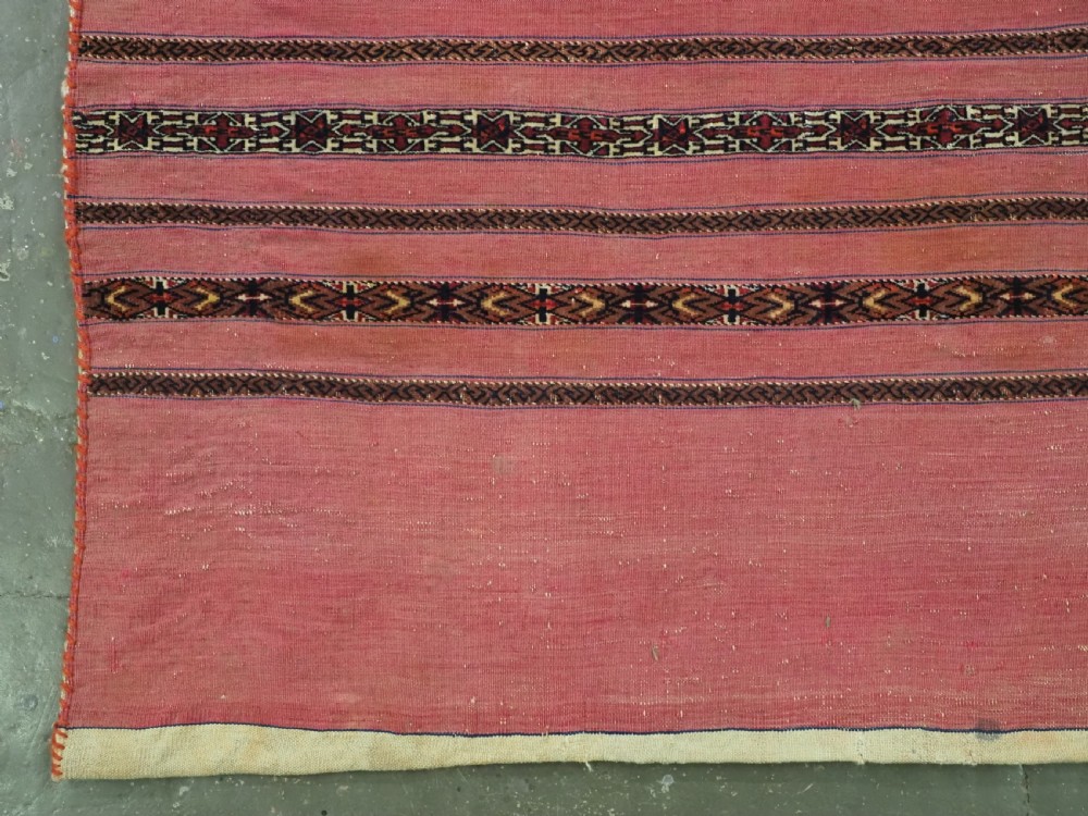 ANTIQUE TEKKE TURKMEN 'KIZIL' CHUVAL, VERY FINE WEAVE, COMPLETE WITH BACK, CIRCA 1880. View VI