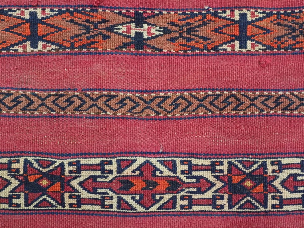 ANTIQUE TEKKE TURKMEN 'KIZIL' CHUVAL, VERY FINE WEAVE, COMPLETE WITH BACK, CIRCA 1880. View VII