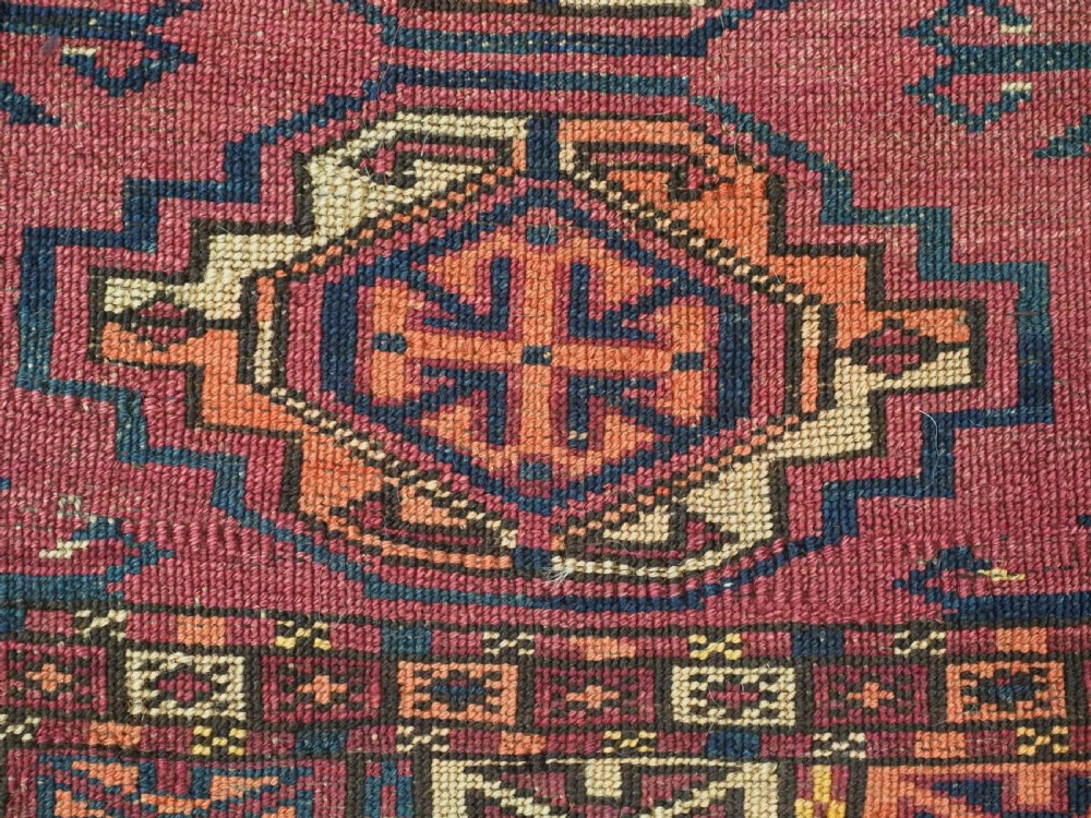ANTIQUE TEKKE (SARYK) TURKMEN 16 GUL CHUVAL FACE, SCARCE COCHINEAL FIELD COLOUR, CIRCA 1880. View X