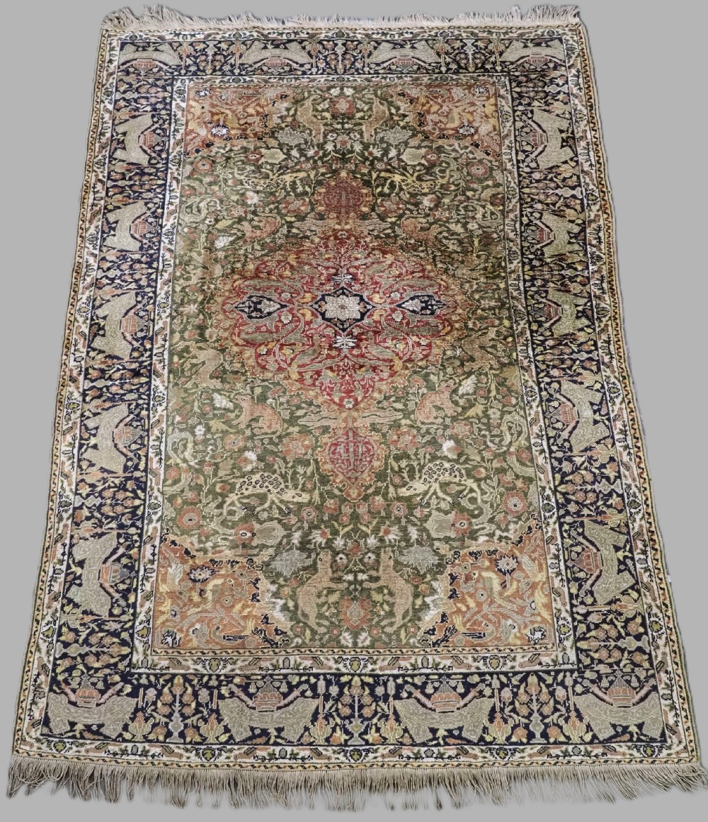 ANTIQUE TURKISH KAYSERI PICTORIAL SILK RUG WITH HUNTING DESIGN, CIRCA 1890.