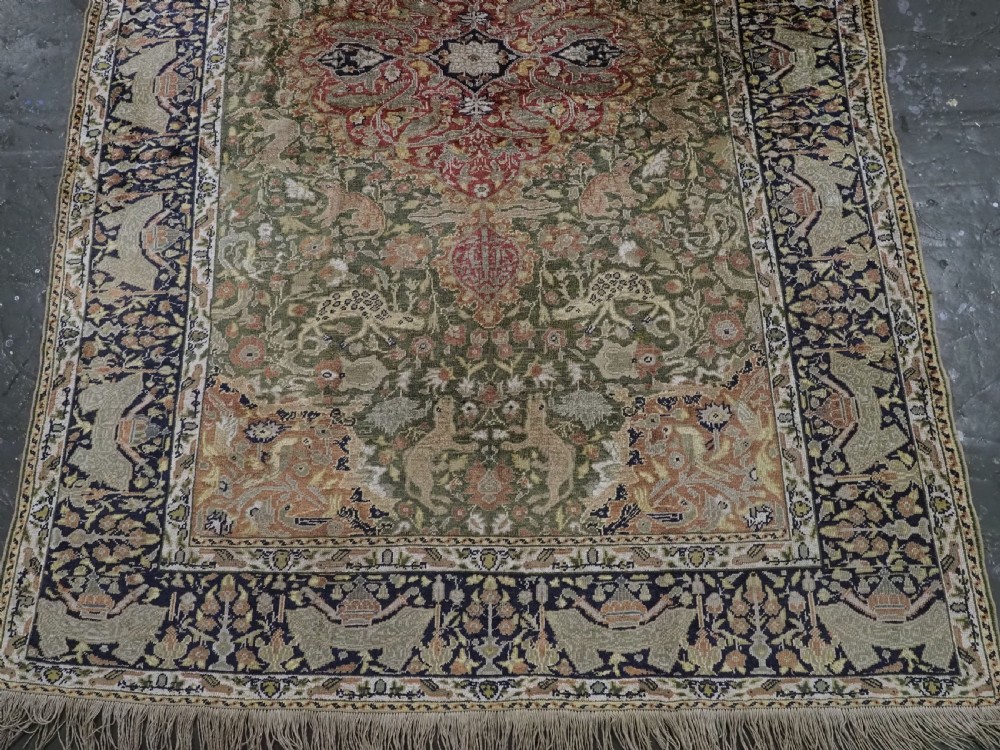 ANTIQUE TURKISH KAYSERI PICTORIAL SILK RUG WITH HUNTING DESIGN, CIRCA 1890. View V