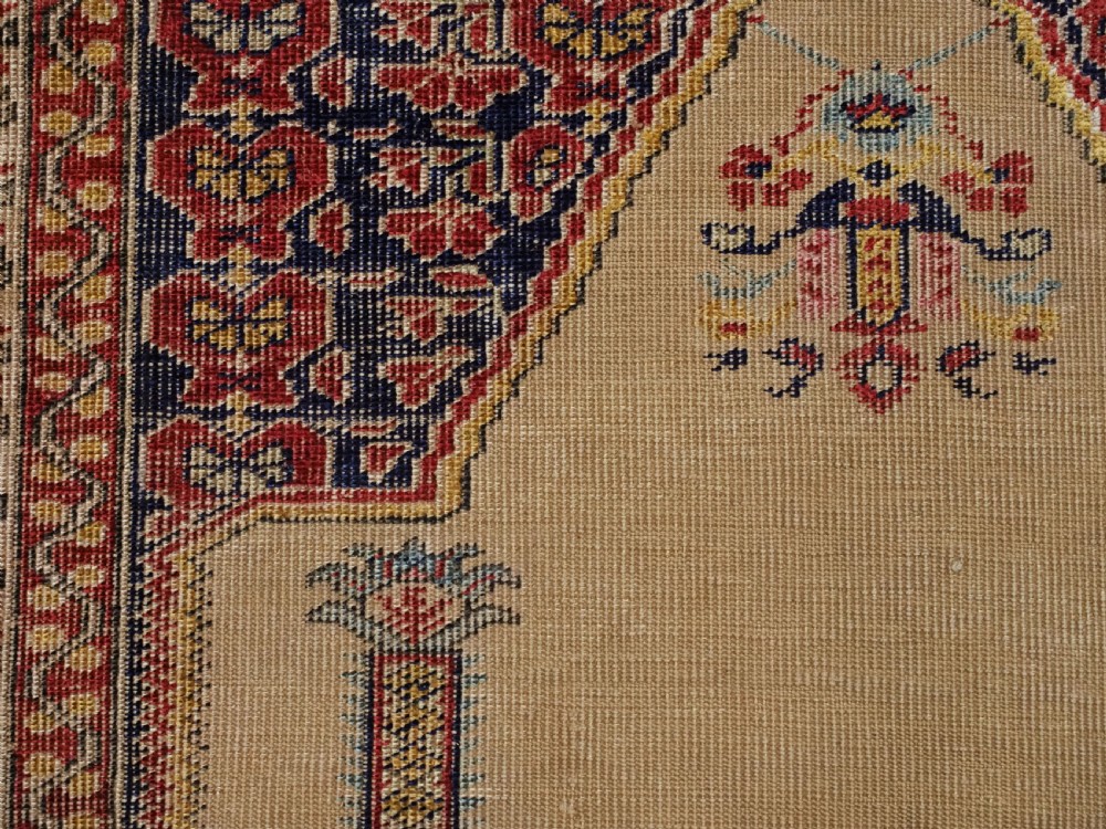 An antique late 19th-century Turkish Kayseri silk prayer rug featuring a central beige mihrab niche surrounded by geometric red and navy borders. View XII