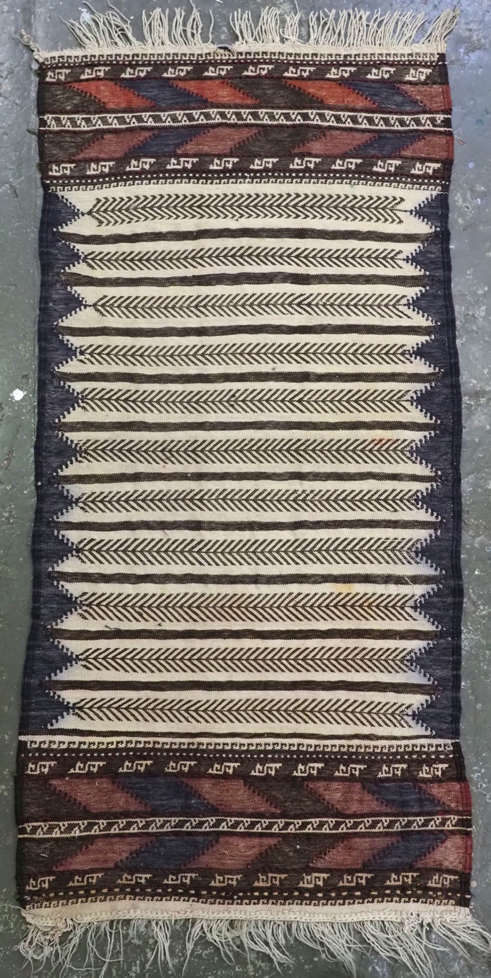 ANTIQUE AFGHAN BALUCH SOFREH EATING CLOTH, DECORATED FLAT WEAVE, CIRCA 1920.