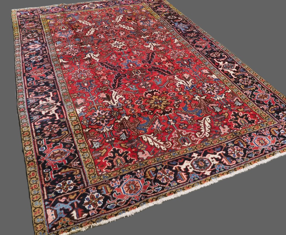 ANTIQUE HERIZ CARPET, ALL OVER DESIGN ON A BOLD RED GROUND, CIRCA 1920/30. View II