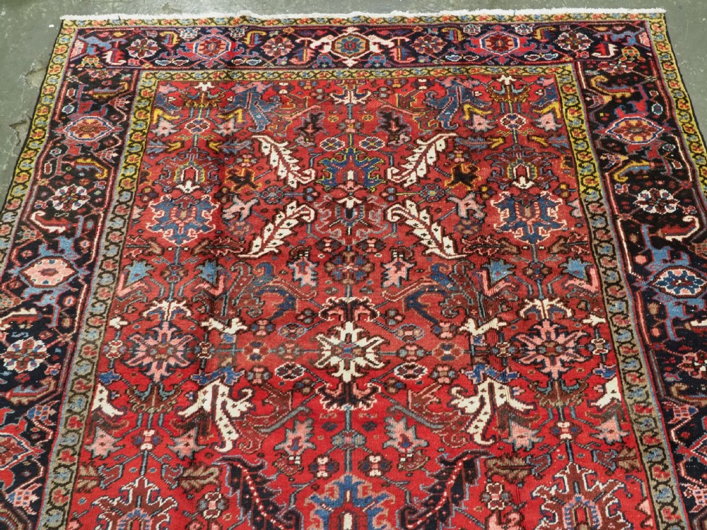 ANTIQUE HERIZ CARPET, ALL OVER DESIGN ON A BOLD RED GROUND, CIRCA 1920/30. View III
