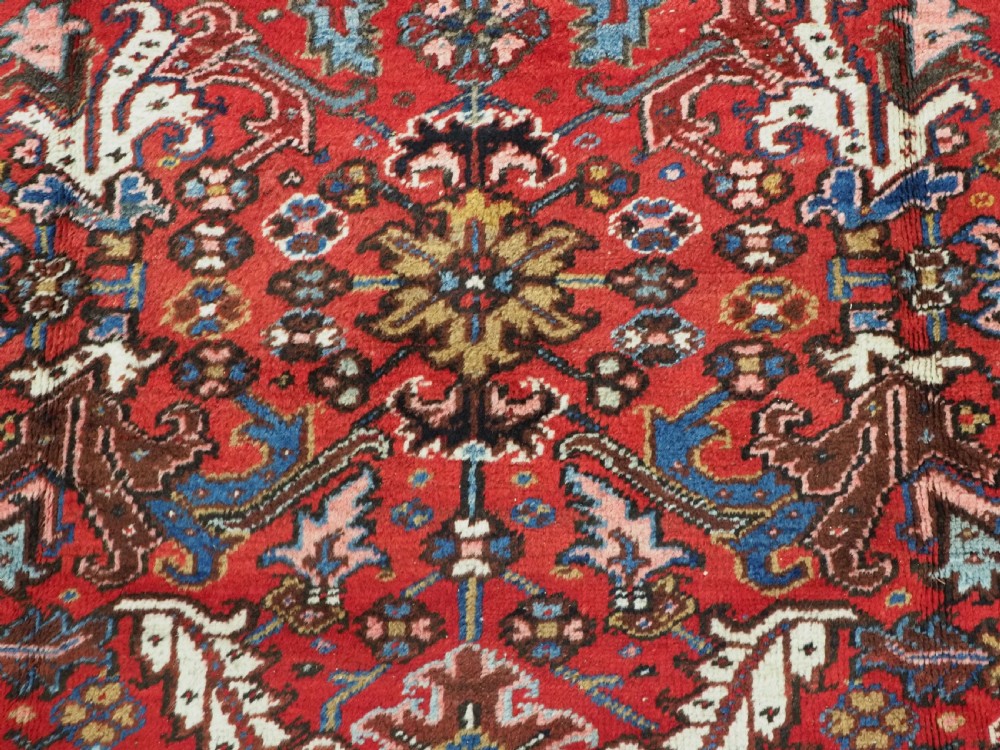 ANTIQUE HERIZ CARPET, ALL OVER DESIGN ON A BOLD RED GROUND, CIRCA 1920/30. View X